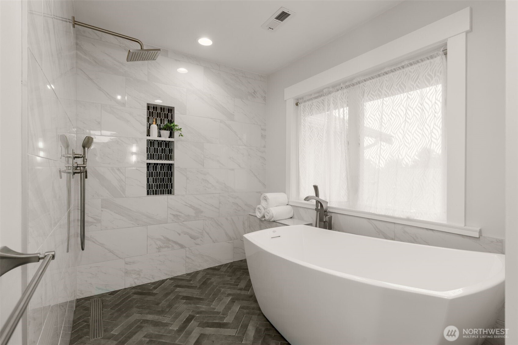 170 Lynn Street Seattle, WA 98109 - Photo 19 of 40 a white bath tub sitting in a bathroom next to a window