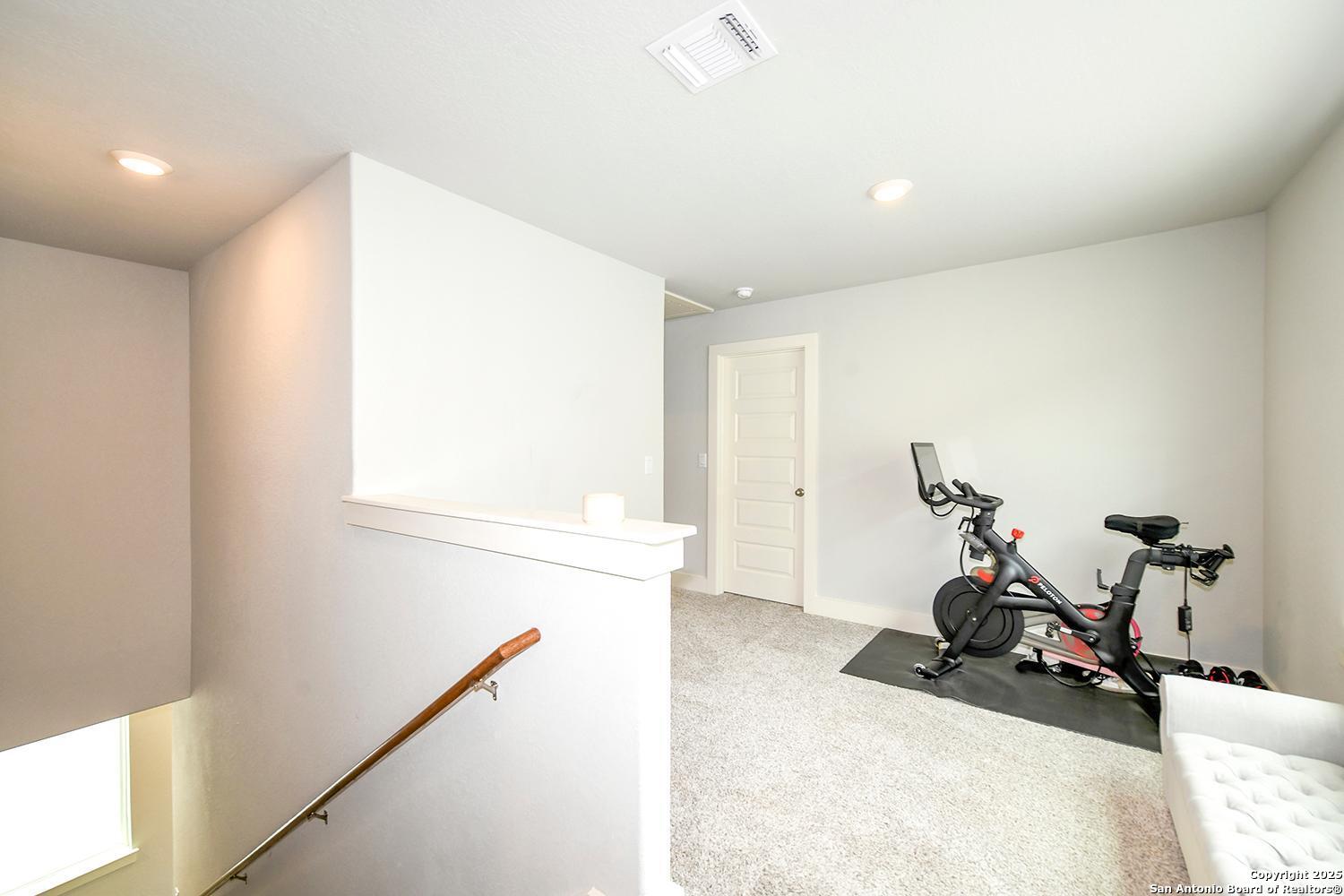 16011 Babcock Road, Unit 13 San Antonio, TX 78255 - Photo 13 of 25 a view of a room with gym equipment