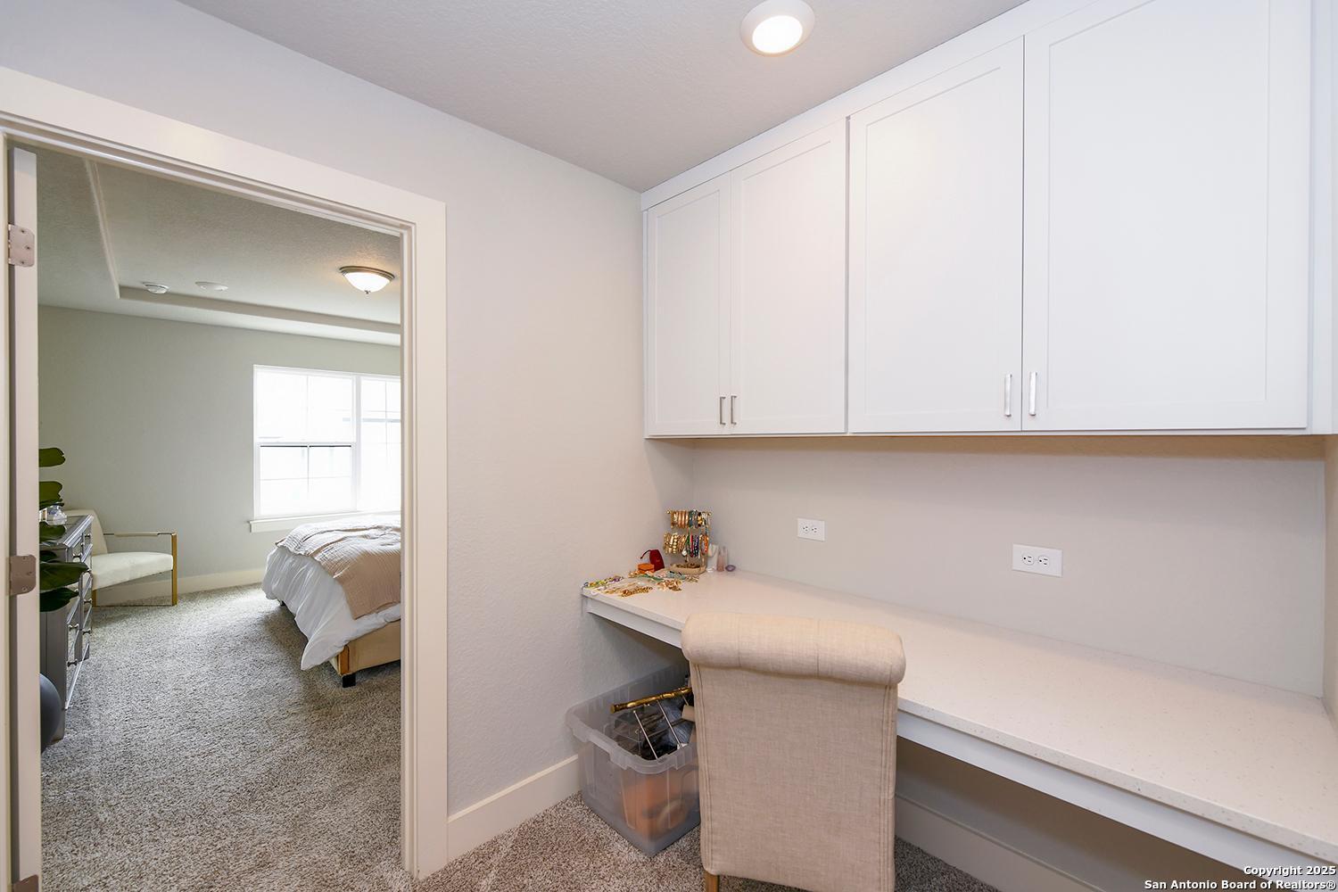 16011 Babcock Road, Unit 13 San Antonio, TX 78255 - Photo 15 of 25 a room with a desk and chair