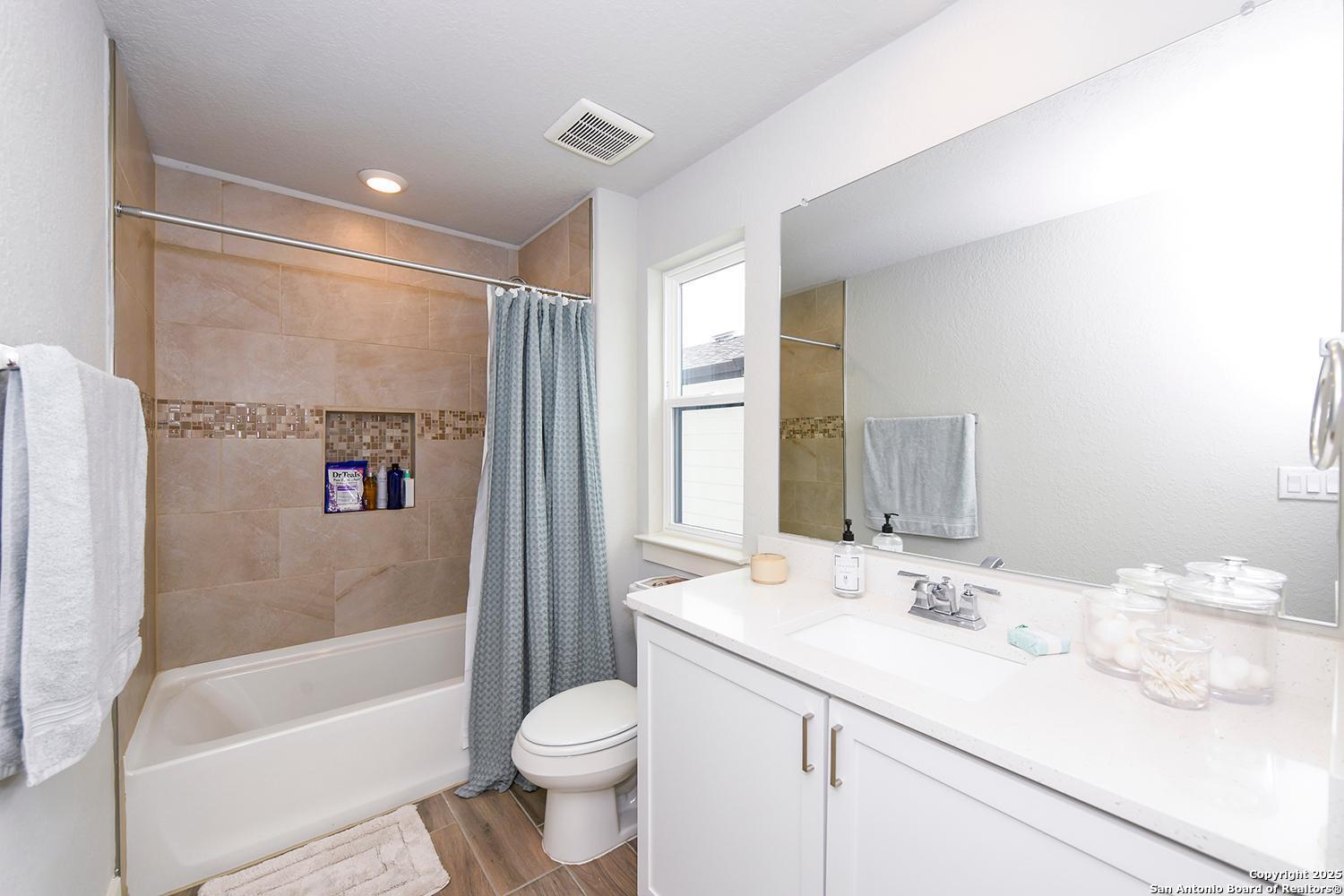 16011 Babcock Road, Unit 13 San Antonio, TX 78255 - Photo 21 of 25 a bathroom with a granite countertop sink toilet and shower