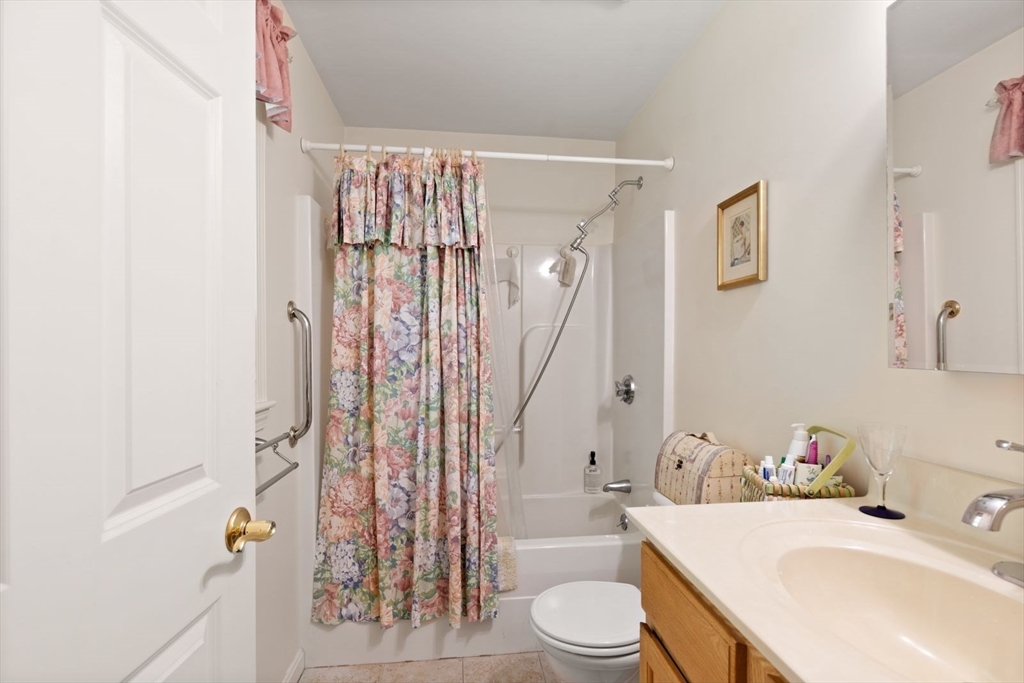60 Brewster Road, Unit 60 Stoughton, MA 02072 - Photo 13 of 18 a bathroom with a sink toilet and shower