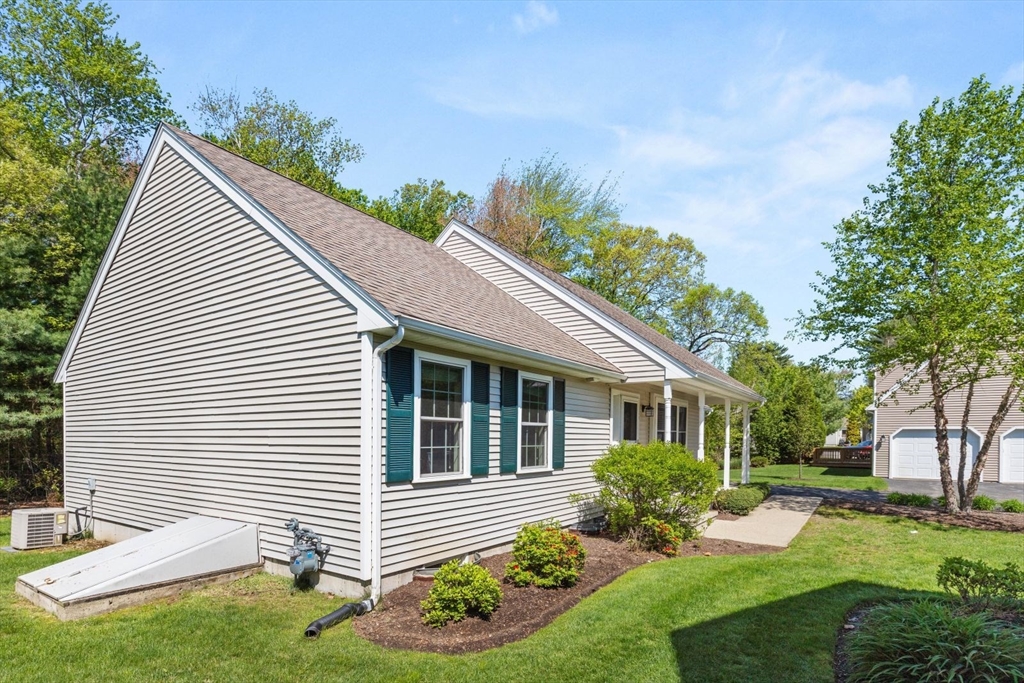 60 Brewster Road, Unit 60 Stoughton, MA 02072 - Photo 15 of 18 a front view of a house with garden