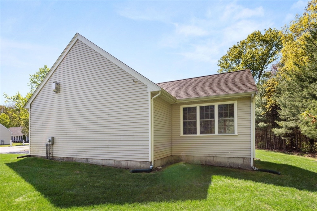 60 Brewster Road, Unit 60 Stoughton, MA 02072 - Photo 17 of 18 a view of a house with a yard