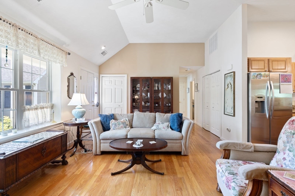 60 Brewster Road, Unit 60 Stoughton, MA 02072 - Photo 3 of 18 a living room with furniture and a large window