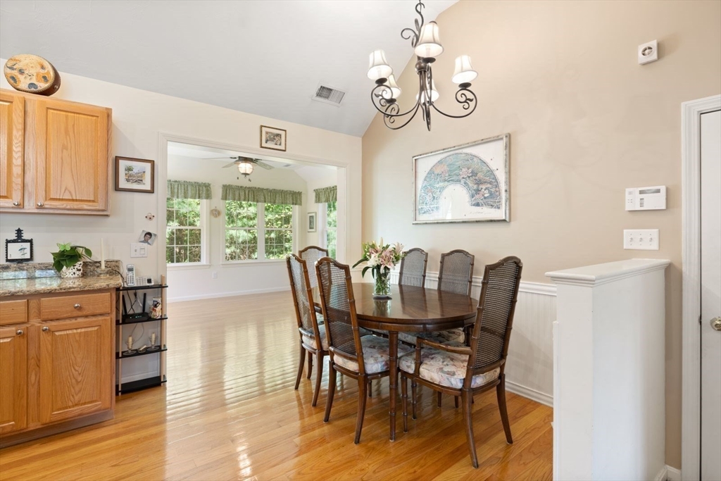 60 Brewster Road, Unit 60 Stoughton, MA 02072 - Photo 4 of 18 a view of a dining room with furniture window and wooden floor