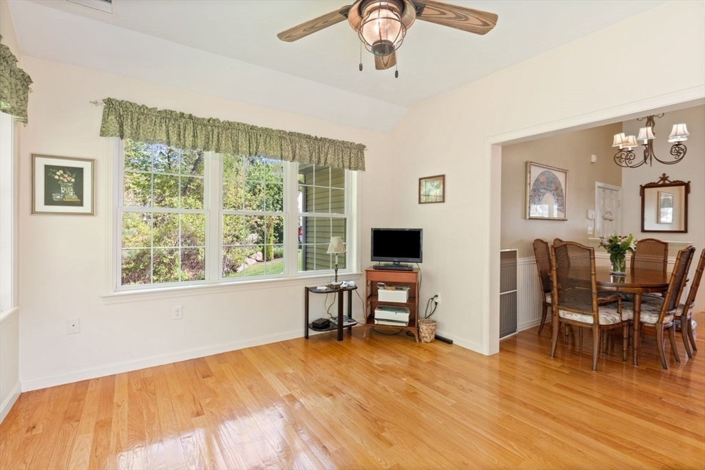 60 Brewster Road, Unit 60 Stoughton, MA 02072 - Photo 7 of 18 a view of a livingroom with furniture window and wooden floor