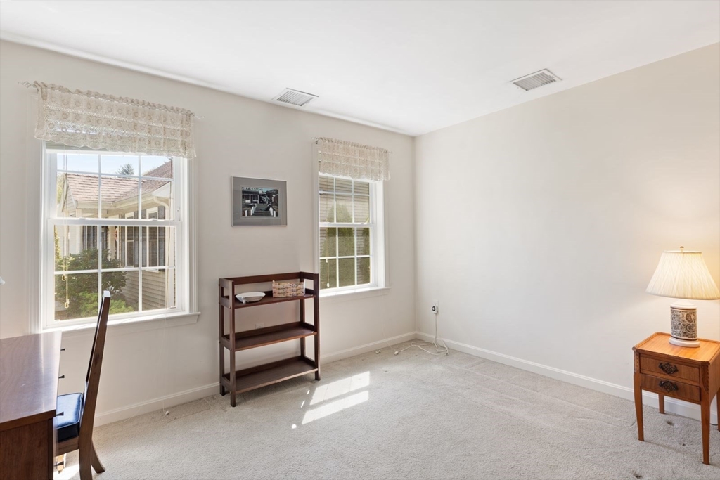 60 Brewster Road, Unit 60 Stoughton, MA 02072 - Photo 9 of 18 a view of room with window and furniture