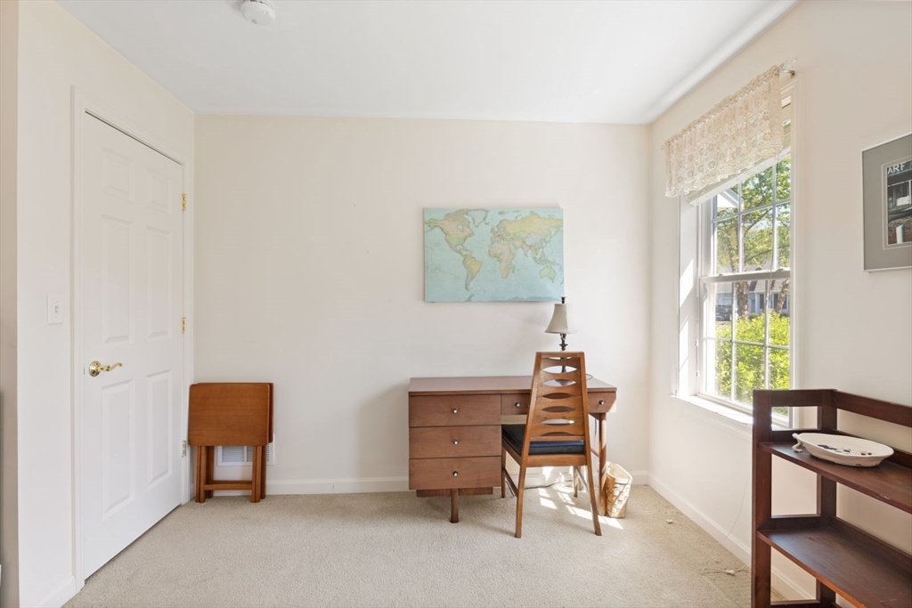 60 Brewster Road, Unit 60 Stoughton, MA 02072 - Photo 10 of 18 a room with chair and window