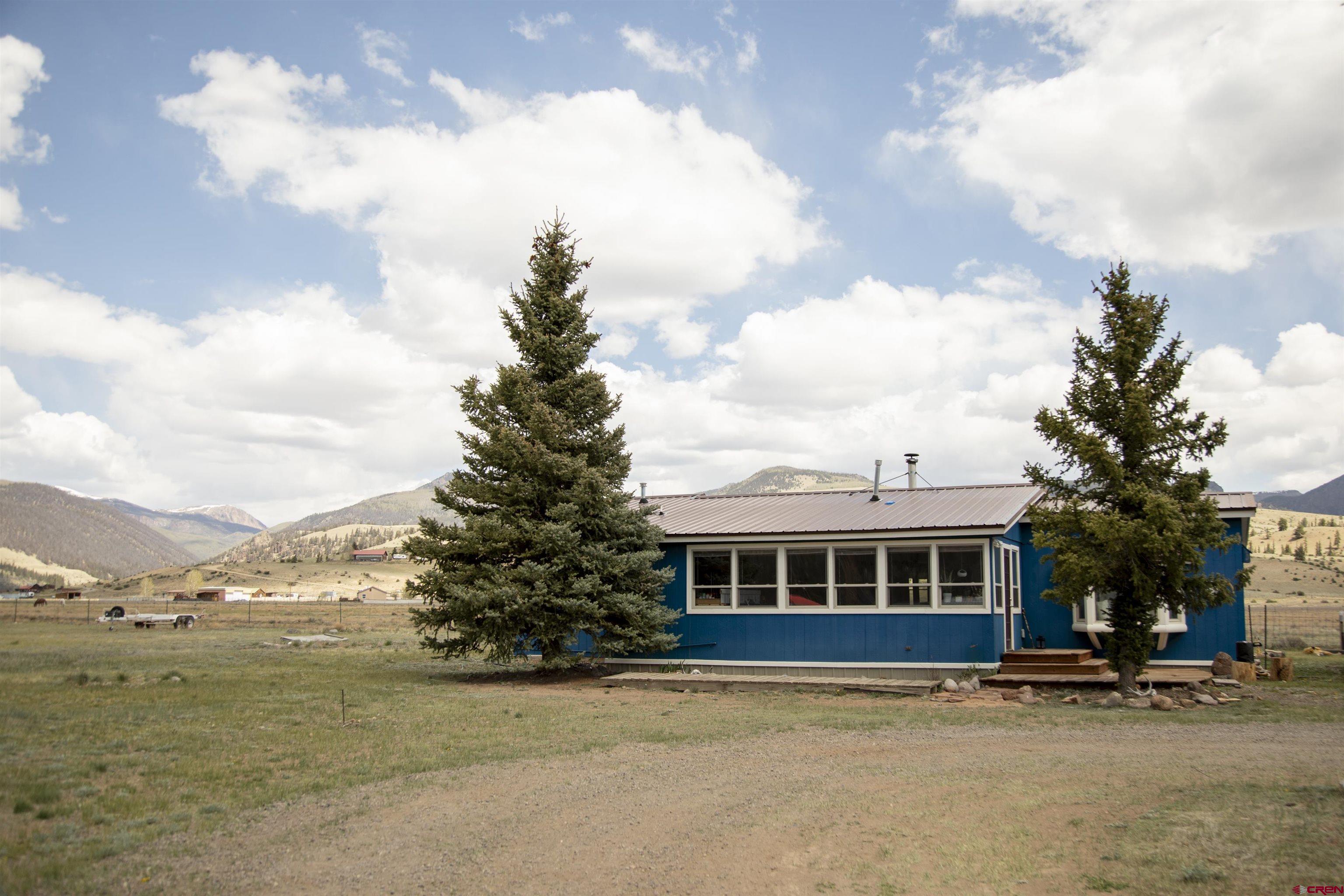507 Ridge Drive Creede, CO 81130 - Photo 1 of 31 a front view of a house with a yard