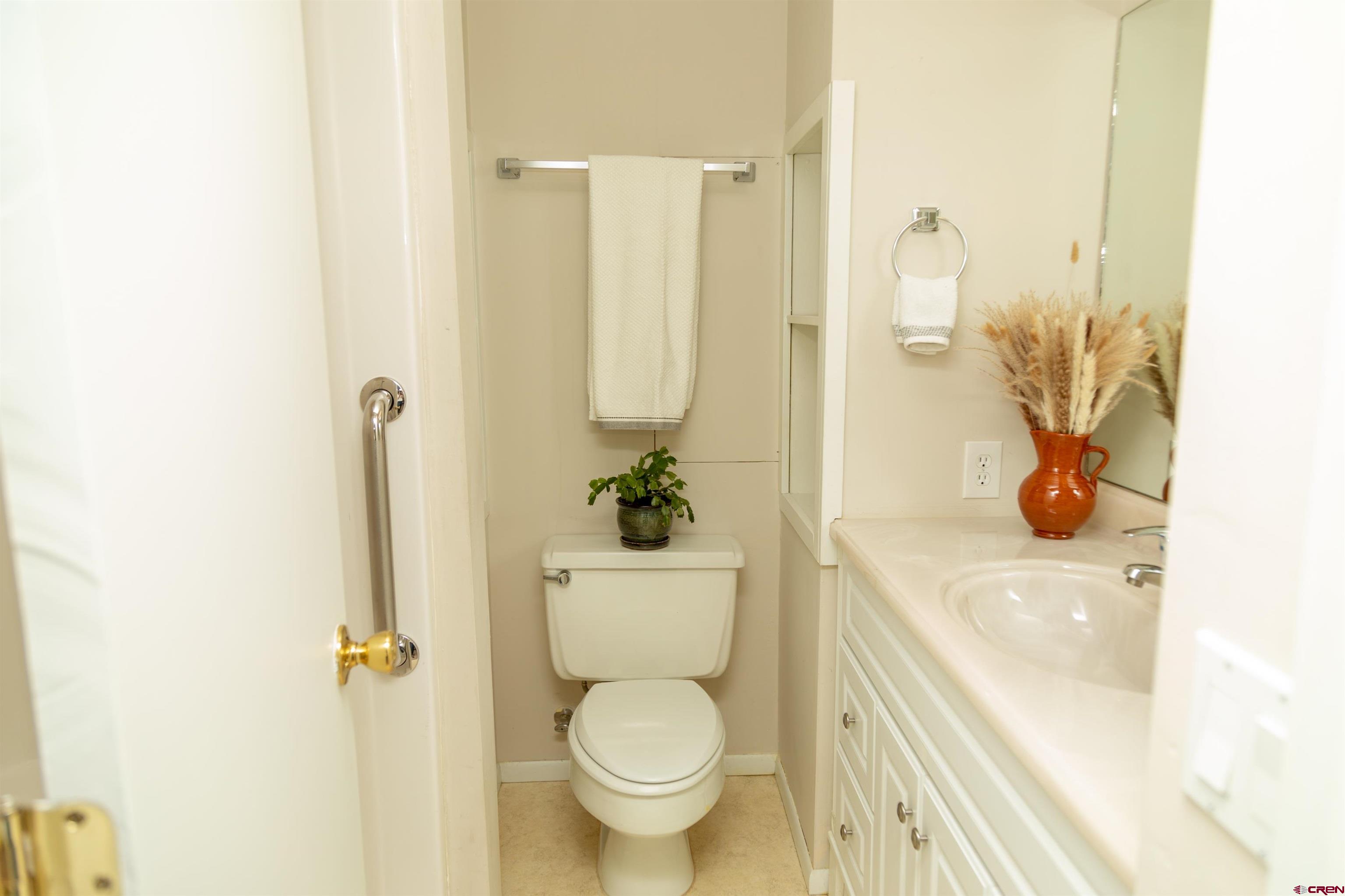 507 Ridge Drive Creede, CO 81130 - Photo 21 of 31 a white toilet sitting next to a bathroom sink