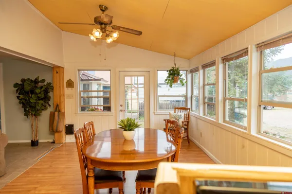a view of a dining room with furniture window and outside view