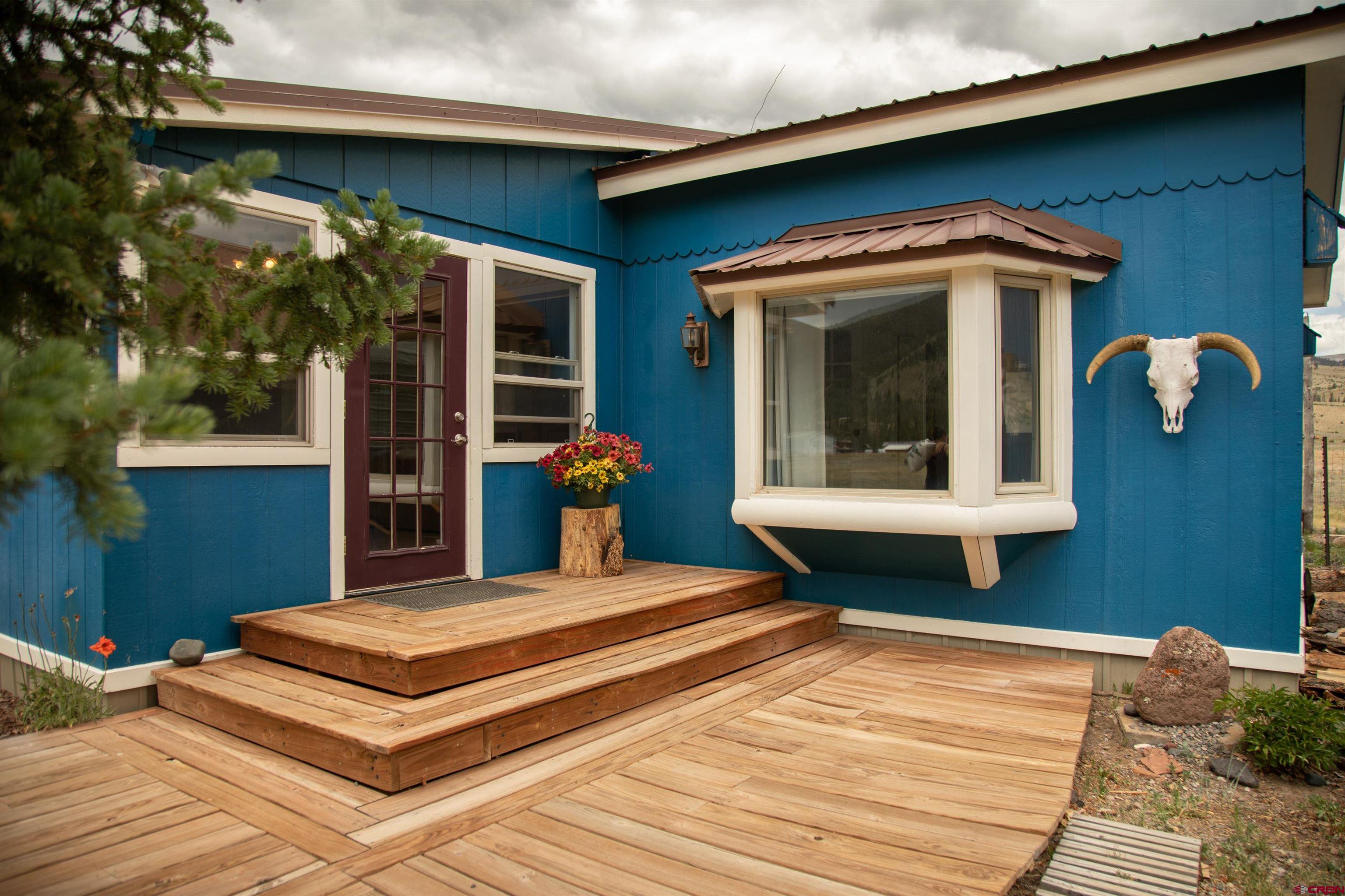507 Ridge Drive Creede, CO 81130 - Photo 25 of 31 a front view of a house with garden