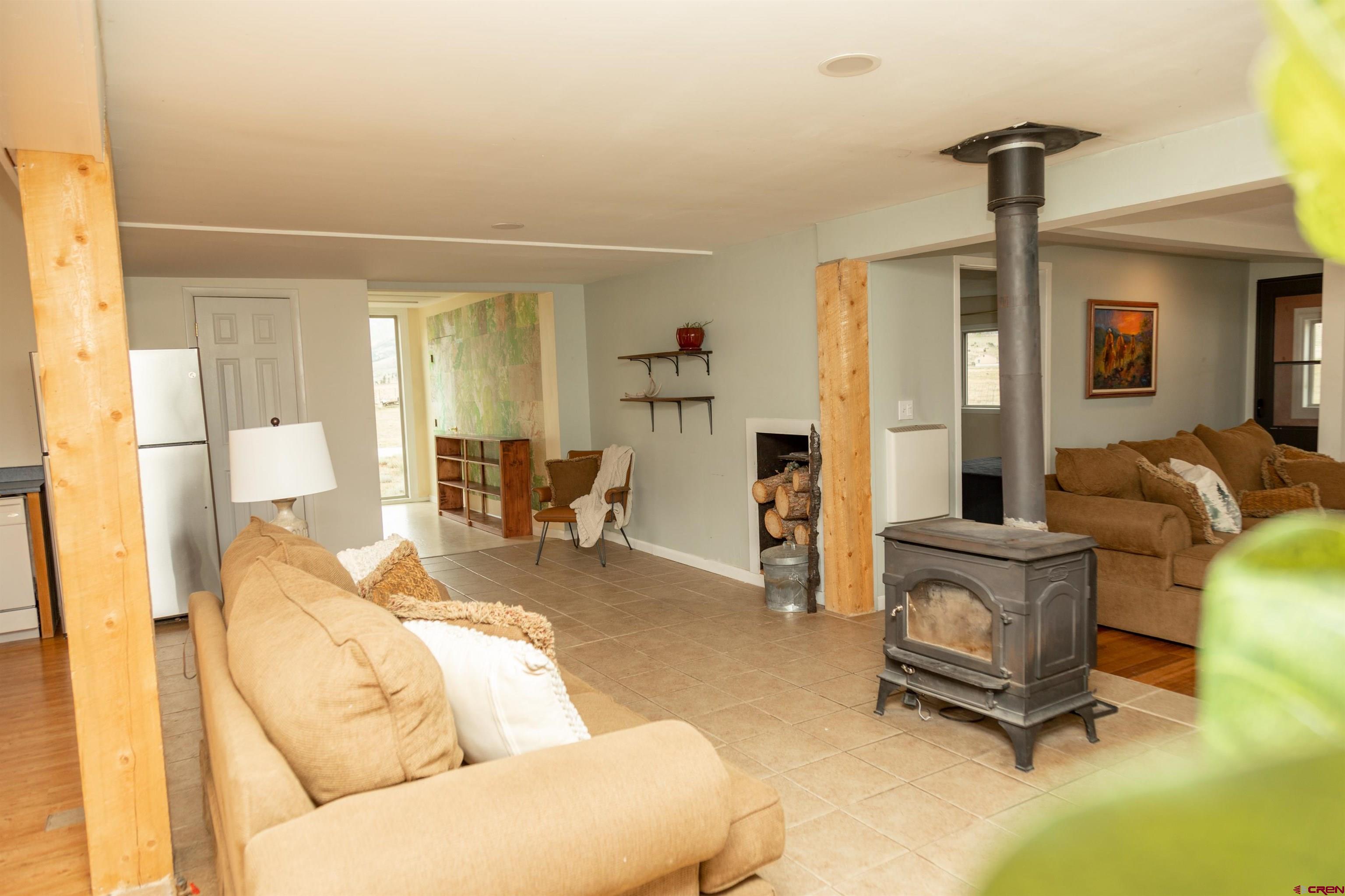 507 Ridge Drive Creede, CO 81130 - Photo 26 of 31 a living room with furniture and a chandelier