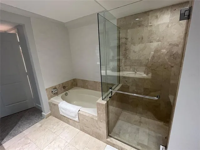 a bathroom with a shower and toilet