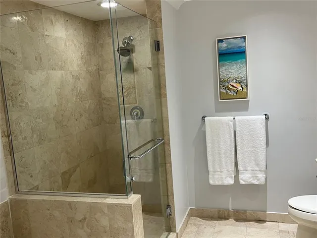 a bathroom with a bathtub and shower