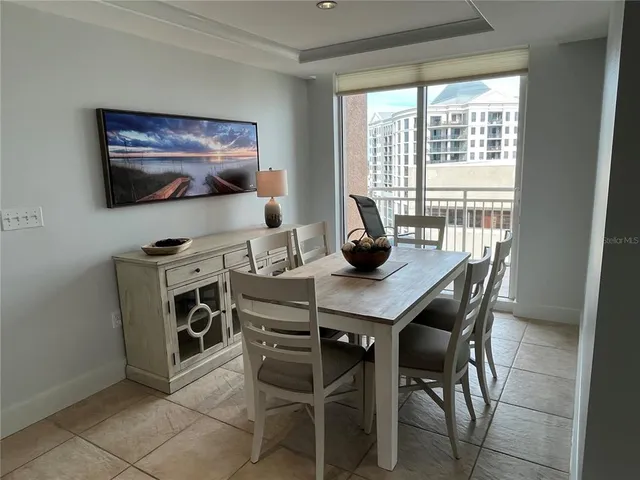 a kitchen with stainless steel appliances granite countertop a refrigerator stove and sink