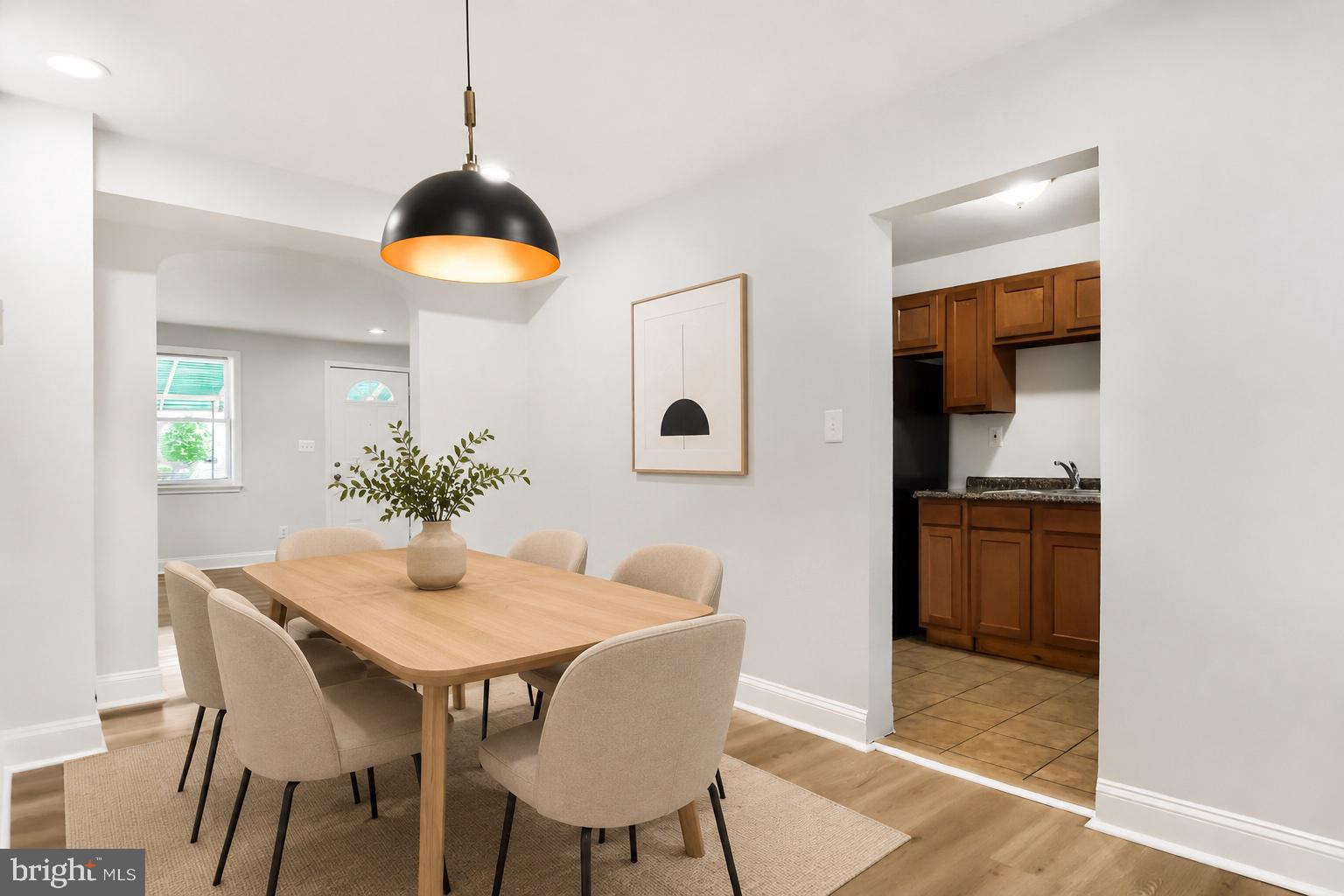 905 Kevin Road Baltimore, MD 21229 - Photo 5 of 19 AI generated staged dining room
