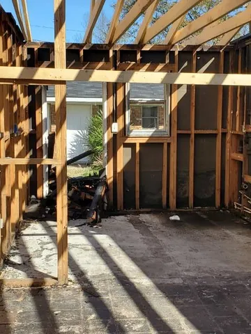 a view of a room with wooden floor