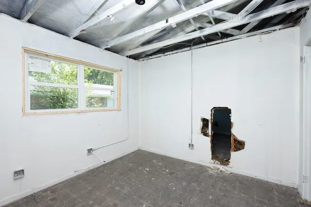 a bathroom with a window and a ceiling fan