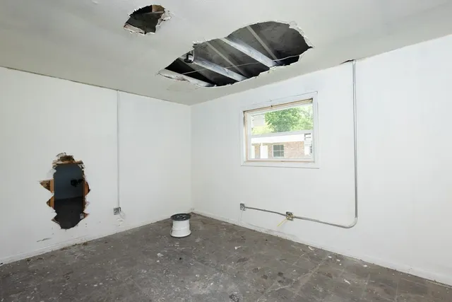 a view of a room with a large window