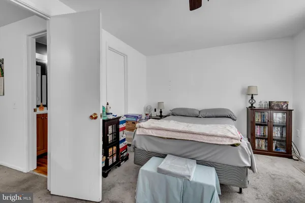 a bed room with a bed and a book shelf
