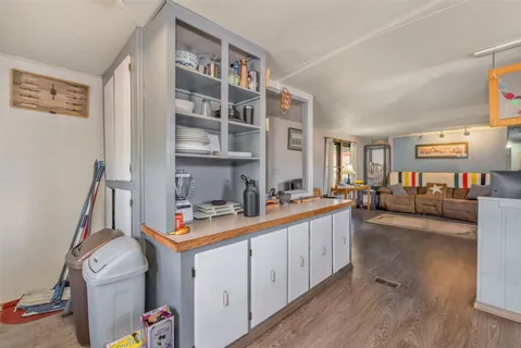 a view of a kitchen with workspace and a window