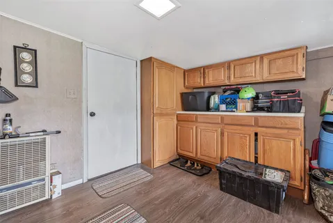 a kitchen with stainless steel appliances a refrigerator and a stove top oven