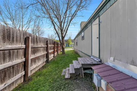 a view of a deck with wooden floor and a stairs