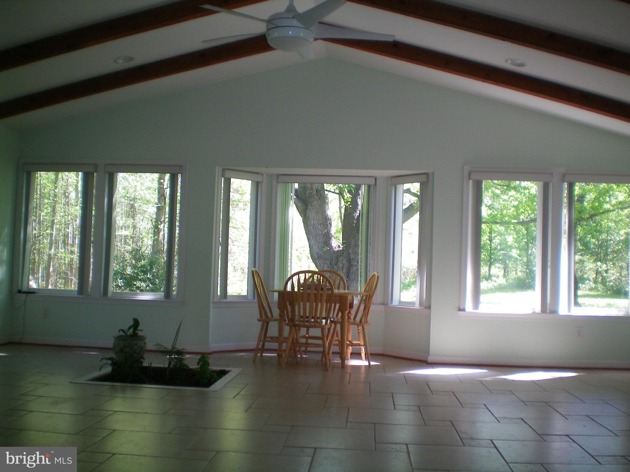 282 Fairhaven Road Tracys Landing, MD 20779 - Photo 2 of 30 a dining room with furniture and floor to ceiling window