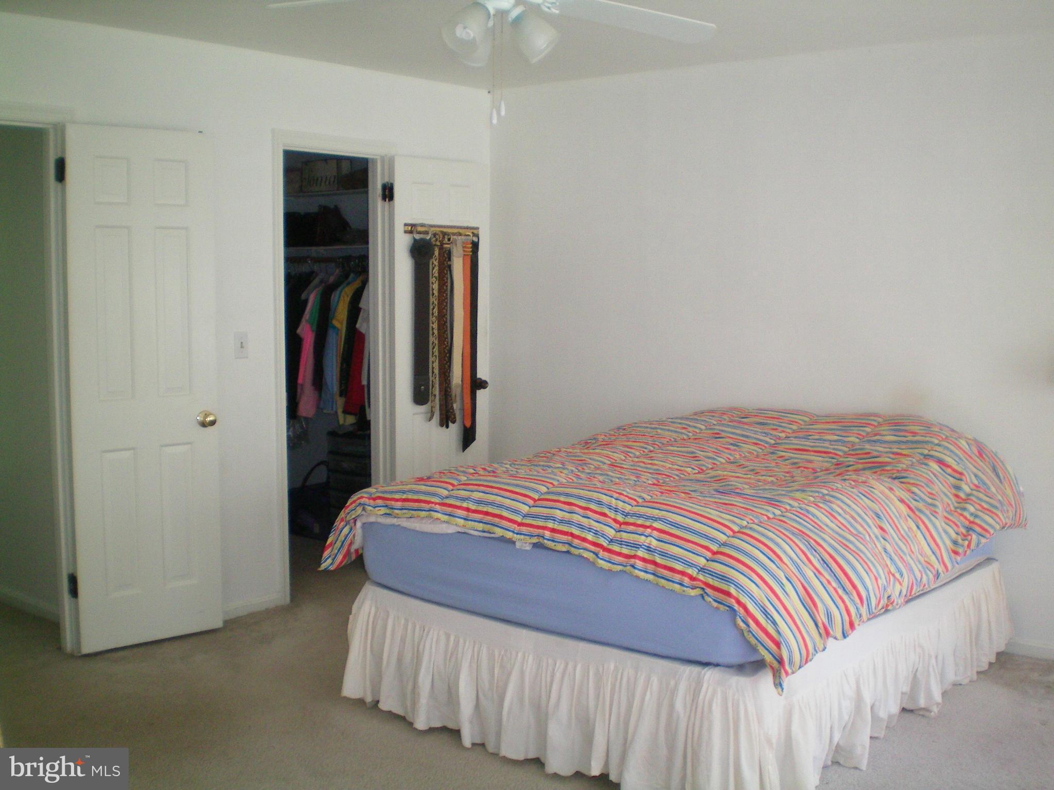 282 Fairhaven Road Tracys Landing, MD 20779 - Photo 11 of 30 a bedroom with a bed and a walk in closet