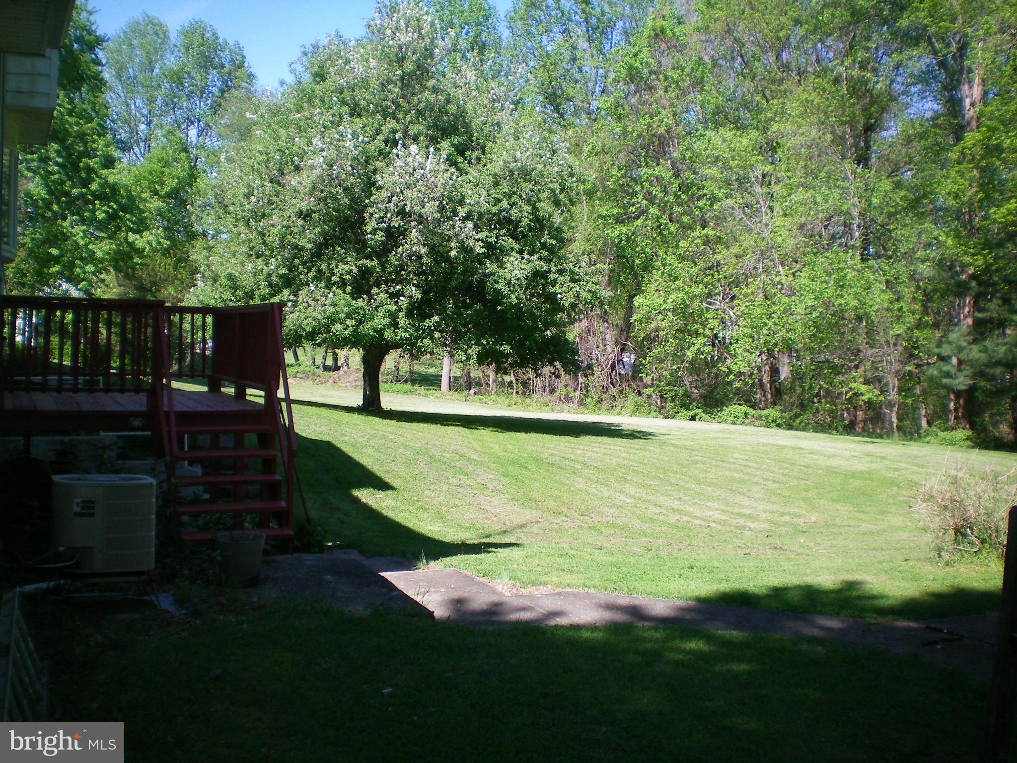 282 Fairhaven Road Tracys Landing, MD 20779 - Photo 22 of 30 a view of a garden from a lake