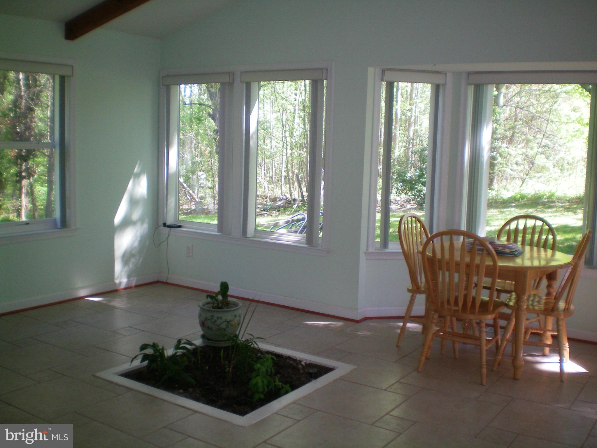 282 Fairhaven Road Tracys Landing, MD 20779 - Photo 4 of 30 a view of a dining room with furniture window and outside view