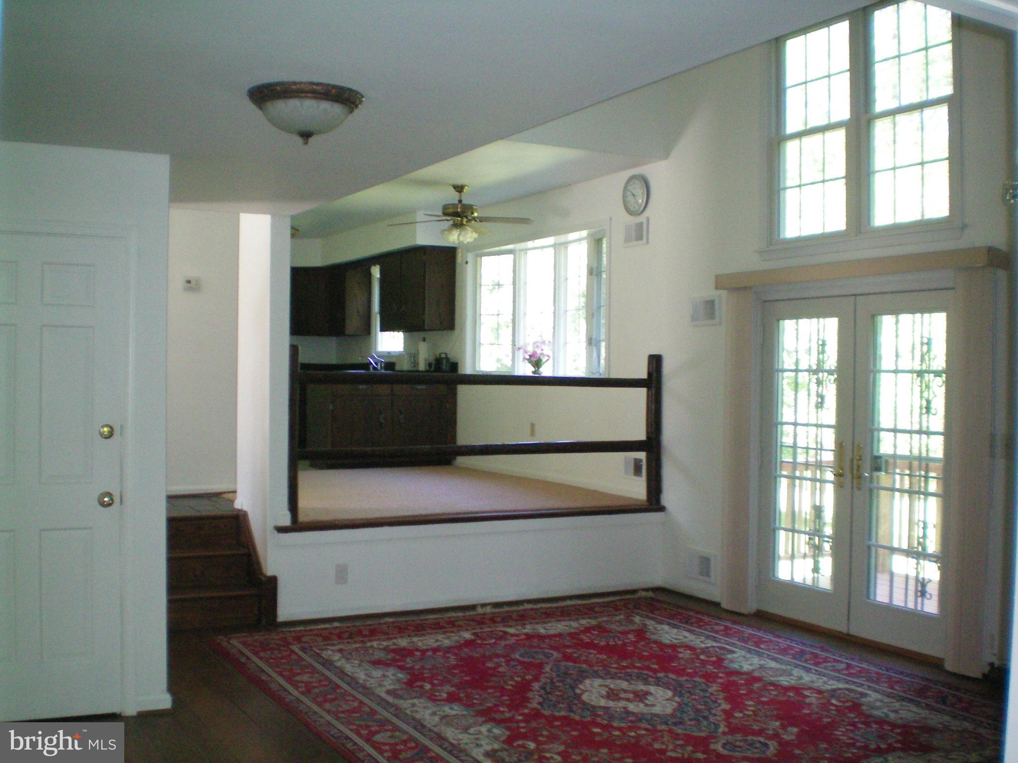 282 Fairhaven Road Tracys Landing, MD 20779 - Photo 7 of 30 a view of an empty room with a window and wooden floor