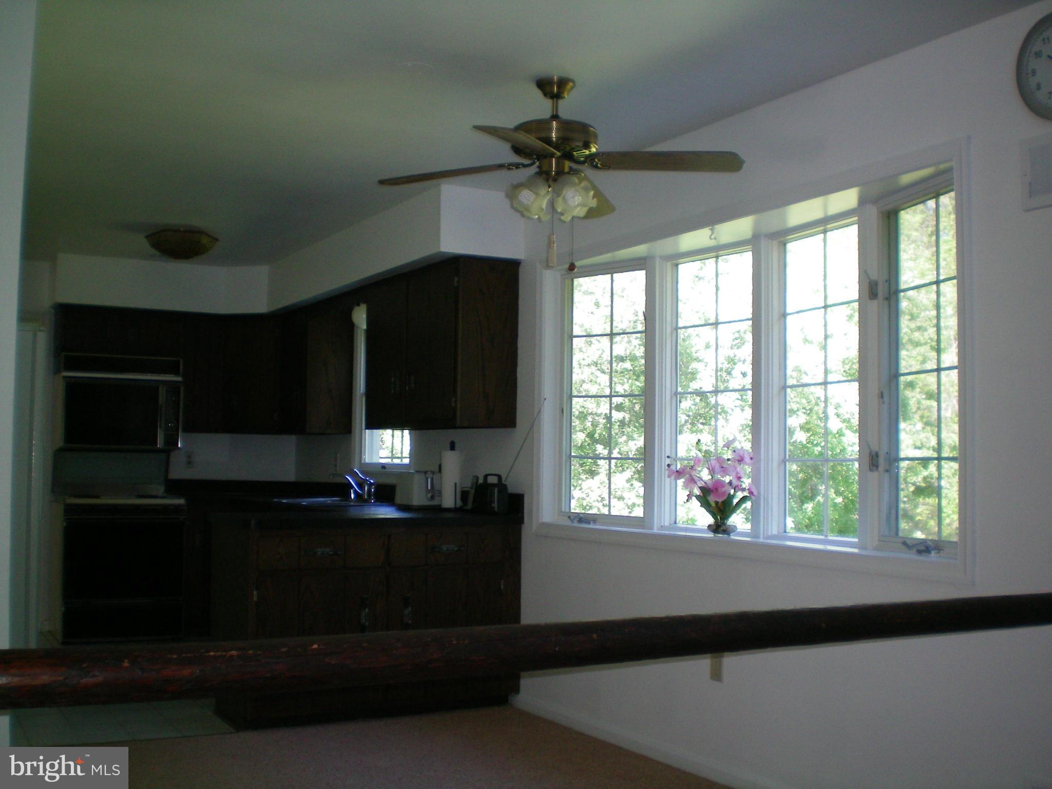 282 Fairhaven Road Tracys Landing, MD 20779 - Photo 8 of 30 a kitchen with a window and a cabinet