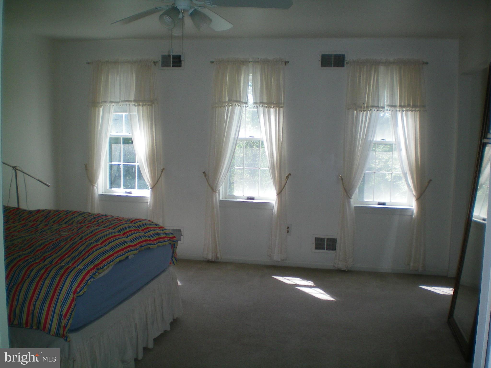 282 Fairhaven Road Tracys Landing, MD 20779 - Photo 10 of 30 a bedroom with windows and bed