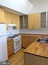 a kitchen with a stove and a sink