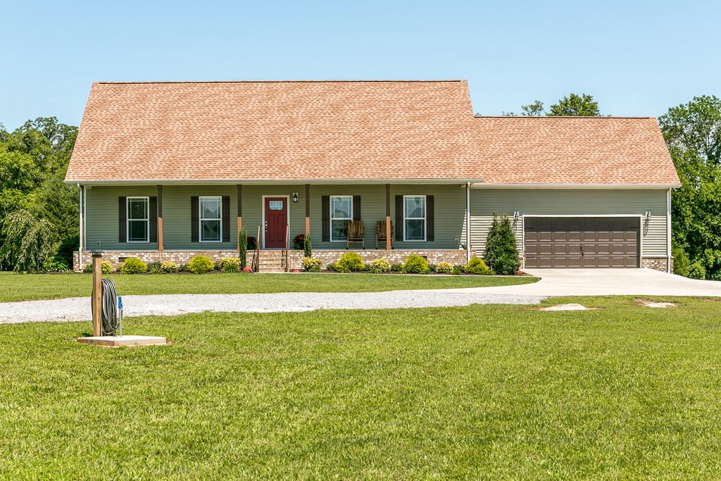 7679 Midland Road Christiana, TN 37037 - Photo 1 of 30 a front view of house with yard and outdoor seating