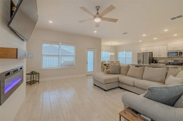 a living room with furniture and a fireplace