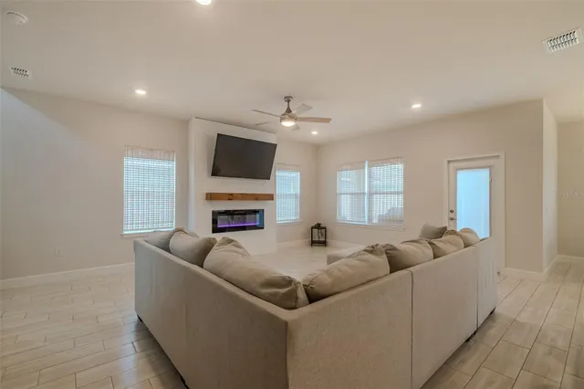 a kitchen with stainless steel appliances kitchen island sink stove and cabinets