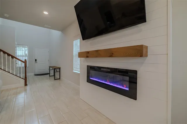 a view of a dining room with furniture wooden floor and chandelier