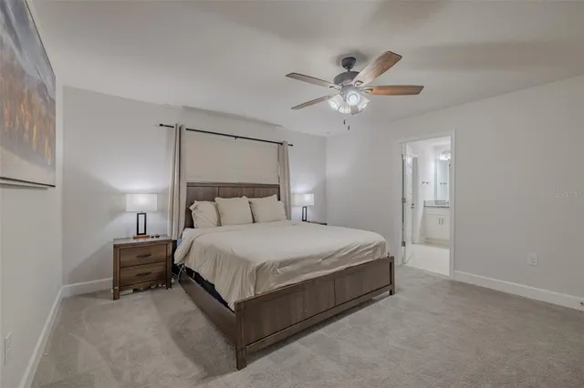 a bedroom with furniture and a flat screen tv