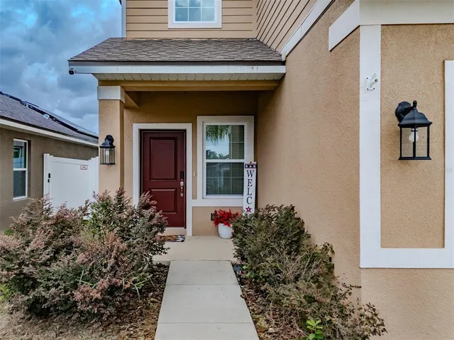 a kitchen with granite countertop a sink stainless steel appliances and cabinets