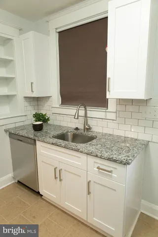 a view of a room with a ceiling fan