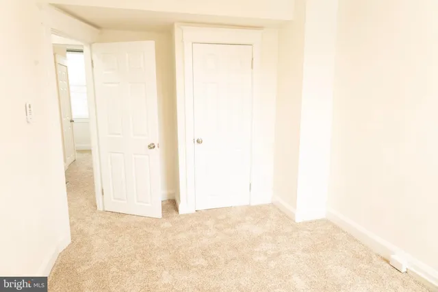 a bathroom with a shower a toilet and a sink