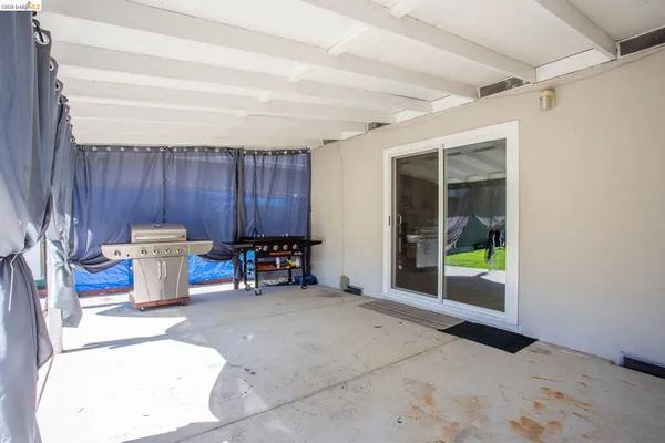 a view of a backyard with a small pool and a fire pit