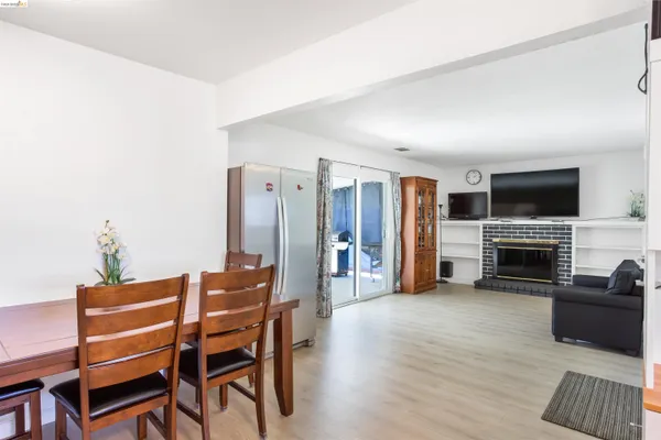 a kitchen with stainless steel appliances a refrigerator and a stove top oven