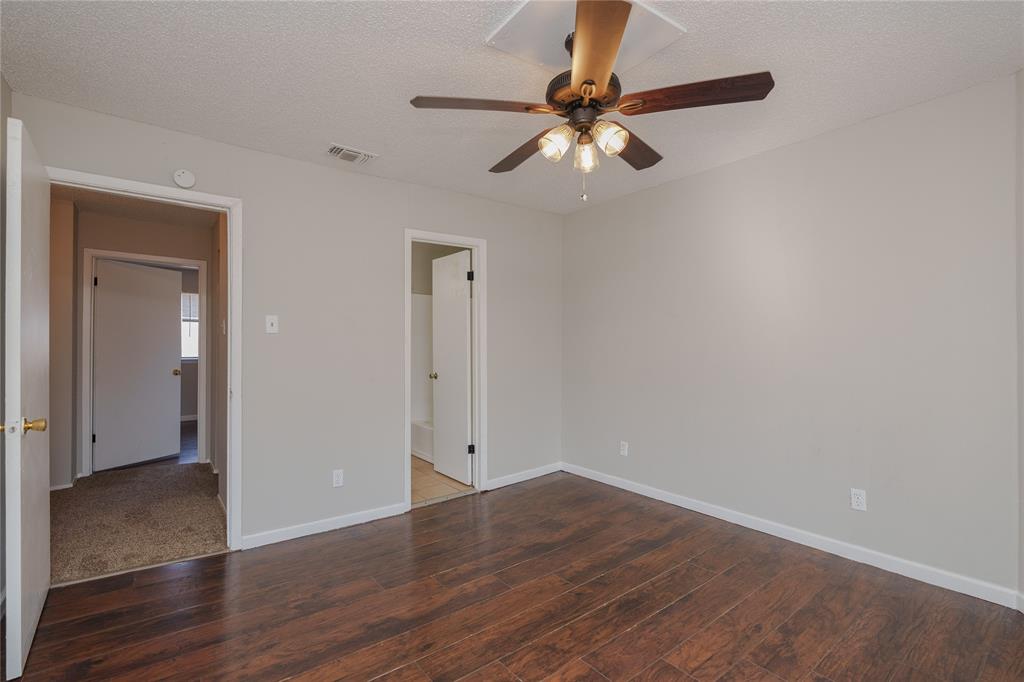 2821 Wimbledon Court Garland, TX 75041 - Photo 16 of 27 a view of a room with wooden floor