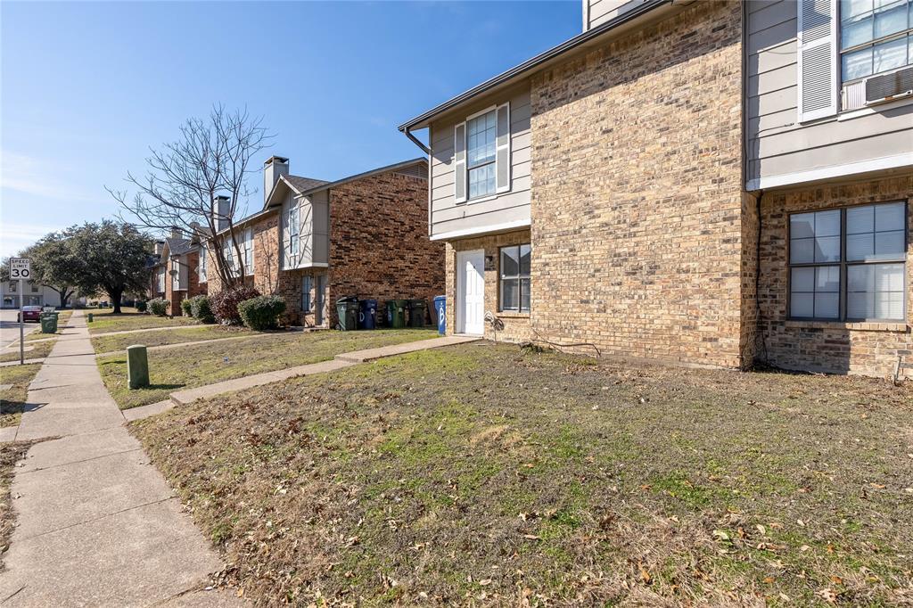 2821 Wimbledon Court Garland, TX 75041 - Photo 27 of 27 a view of brick house with a yard