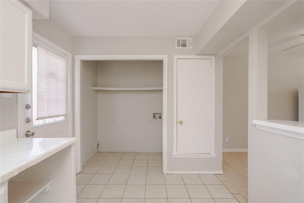 2821 Wimbledon Court Garland, TX 75041 - Photo 4 of 27 a bathroom with a sink a mirror and a shower