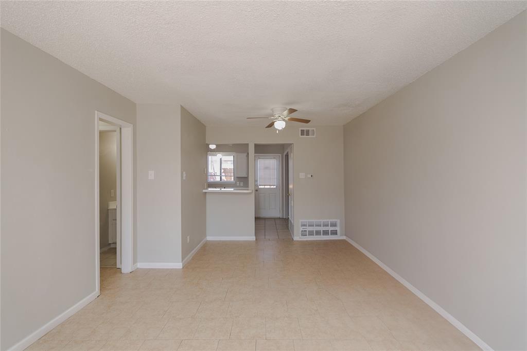 2821 Wimbledon Court Garland, TX 75041 - Photo 8 of 27 a view of a kitchen with a sink and a refrigerator